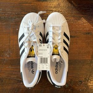 Brand new women’s Adidas superstar size 7 1/2 black stripes